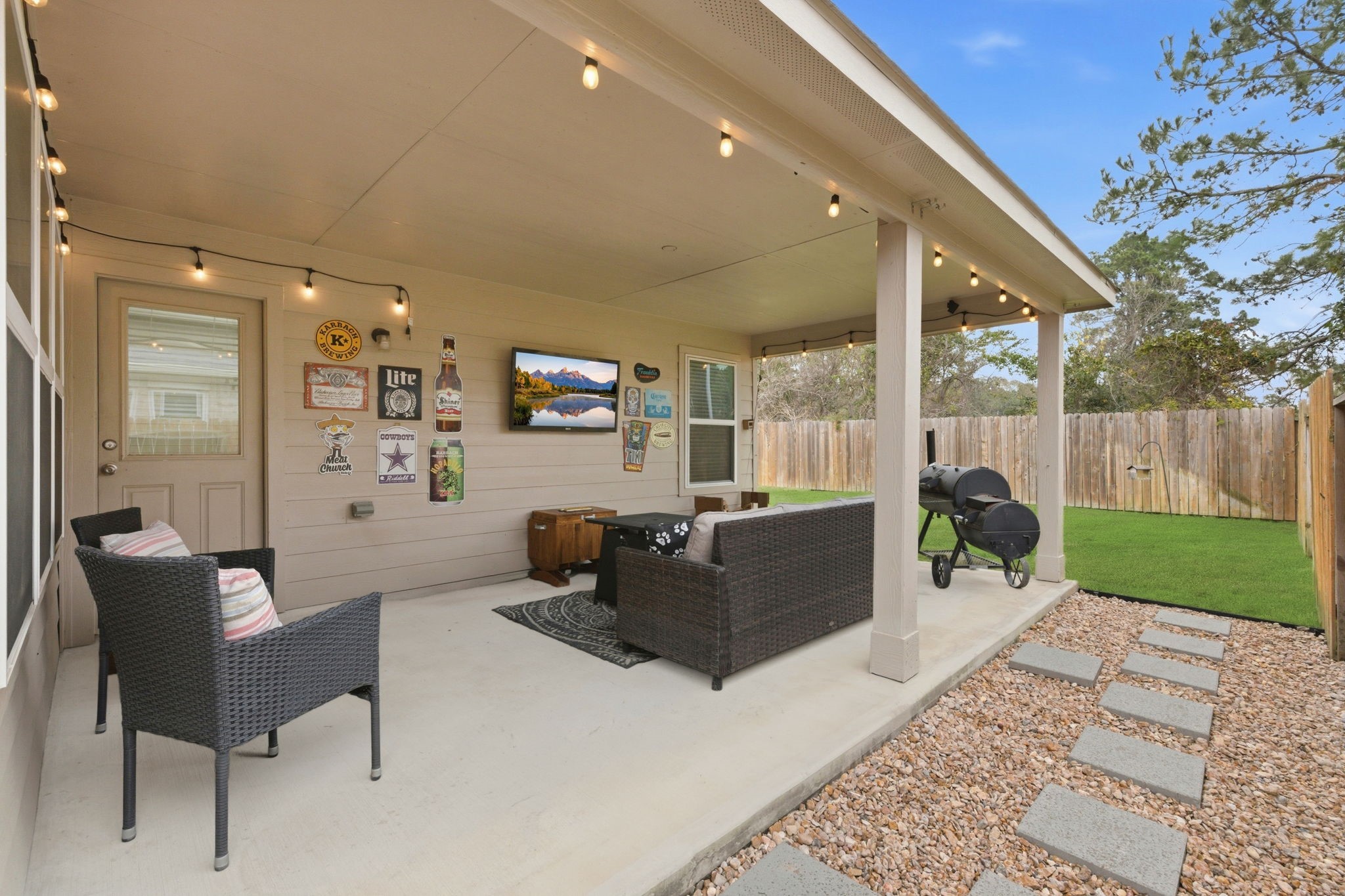 27146 Grey Fox Run Magnolia, TX 77354 - Photo 35 of 44 a living room with furniture a rug and a floor to ceiling window