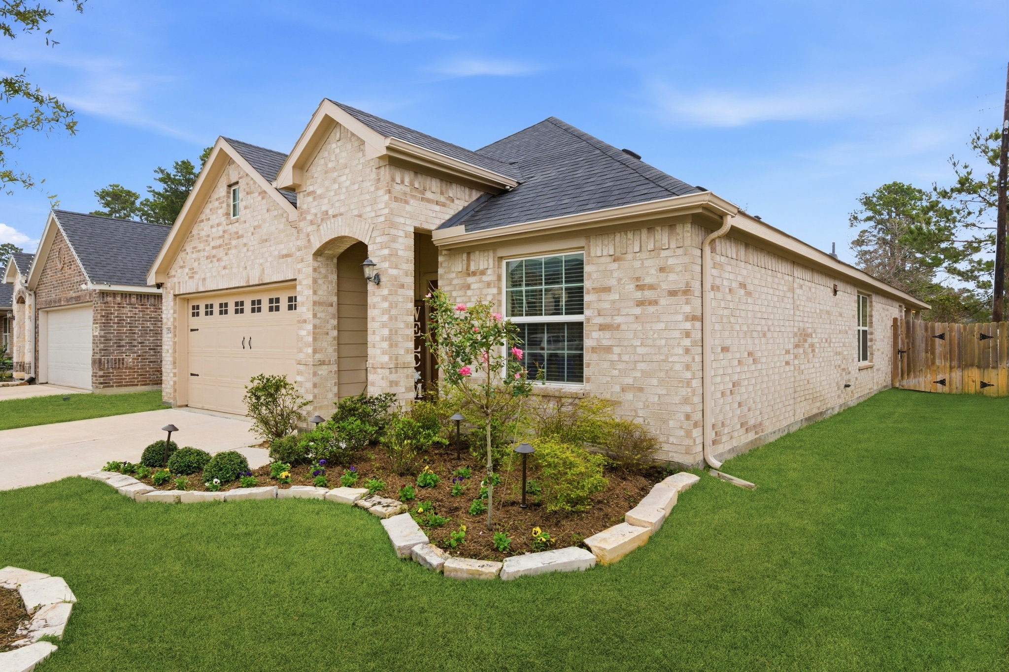 27146 Grey Fox Run Magnolia, TX 77354 - Photo 6 of 44 a front view of a house with a garden