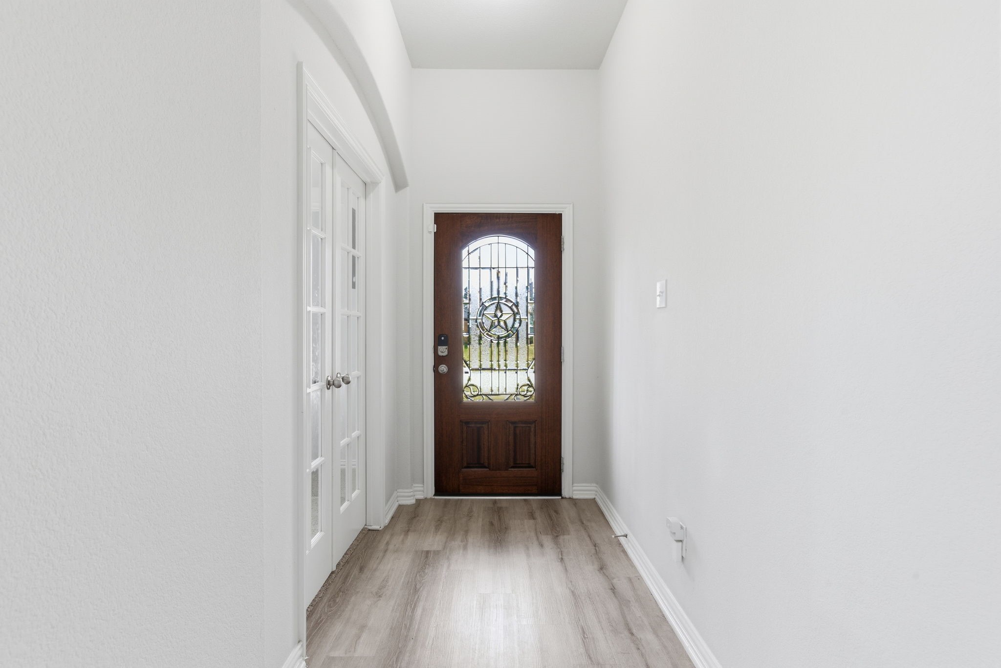 27146 Grey Fox Run Magnolia, TX 77354 - Photo 8 of 44 a view of a hallway with wooden floor