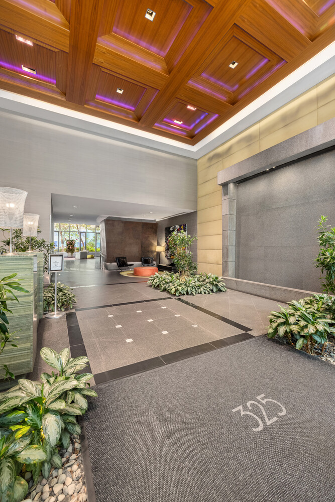 325 5th Avenue, Unit 39C Manhattan, NY 10016 - Photo 11 of 19 a lobby with furniture and flowers