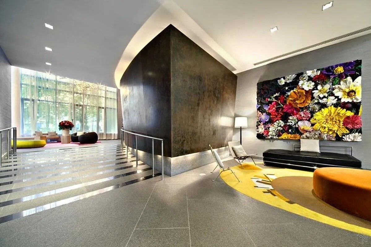 325 5th Avenue, Unit 39C Manhattan, NY 10016 - Photo 12 of 19 a lobby with furniture and flowers