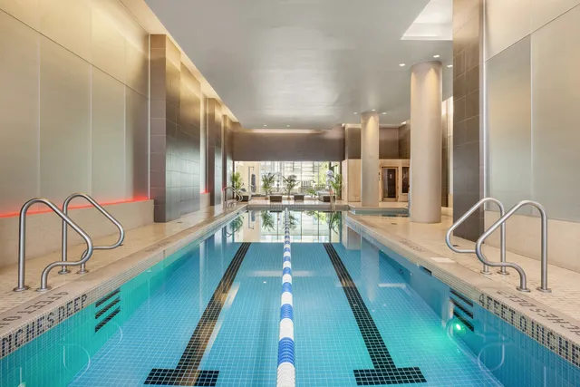 a lobby with furniture and flowers