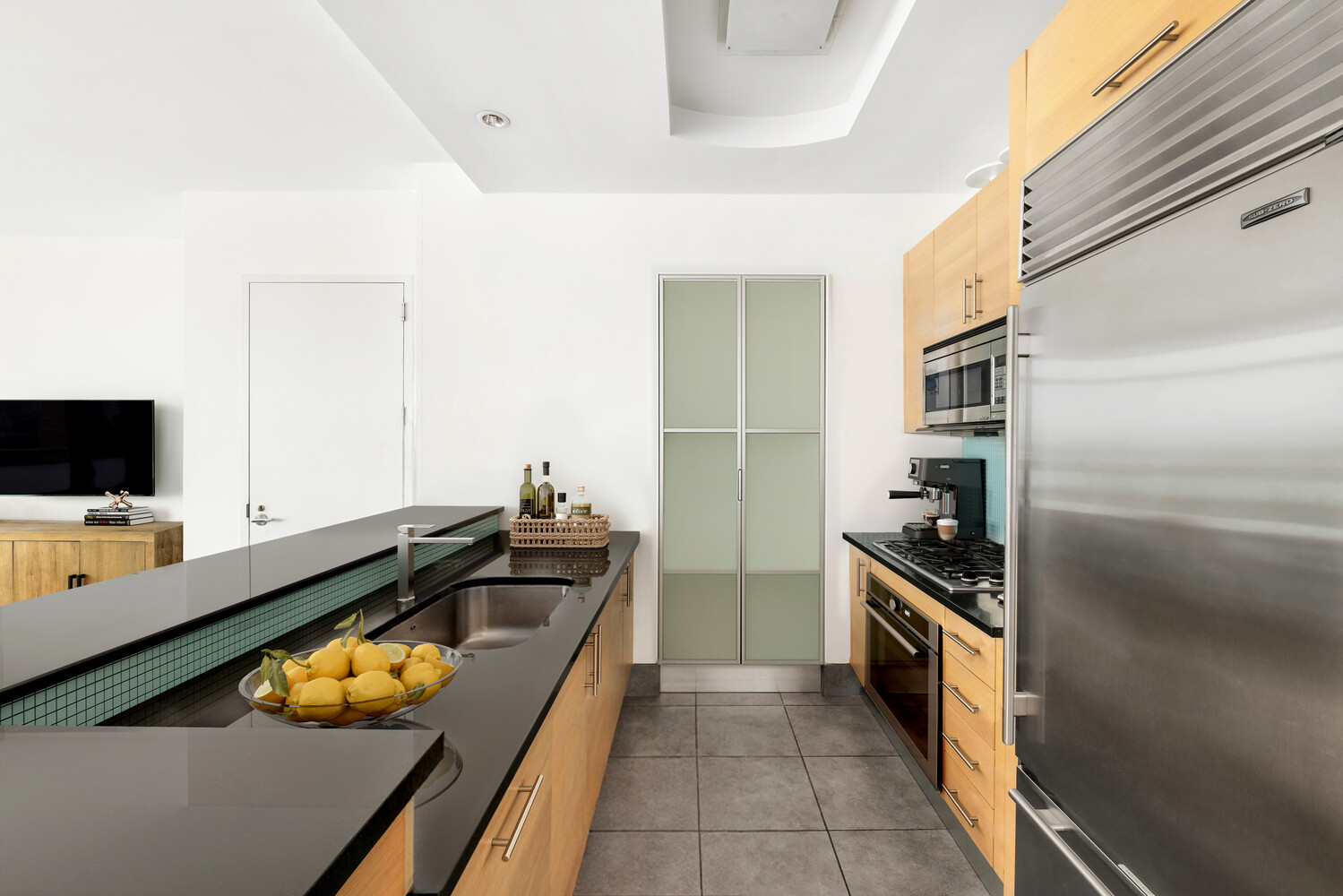 325 5th Avenue, Unit 39C Manhattan, NY 10016 - Photo 6 of 19 a kitchen that has a sink and a stove