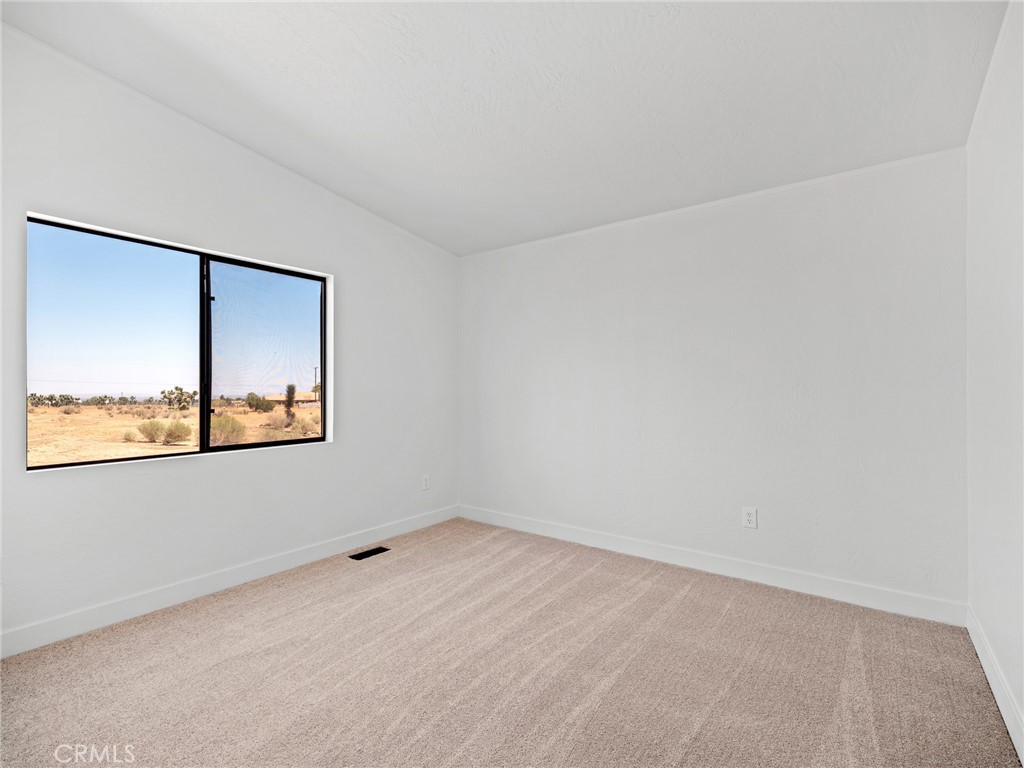 10139 Sonora Road Phelan, CA 92371 - Photo 14 of 37 an empty room with a window
