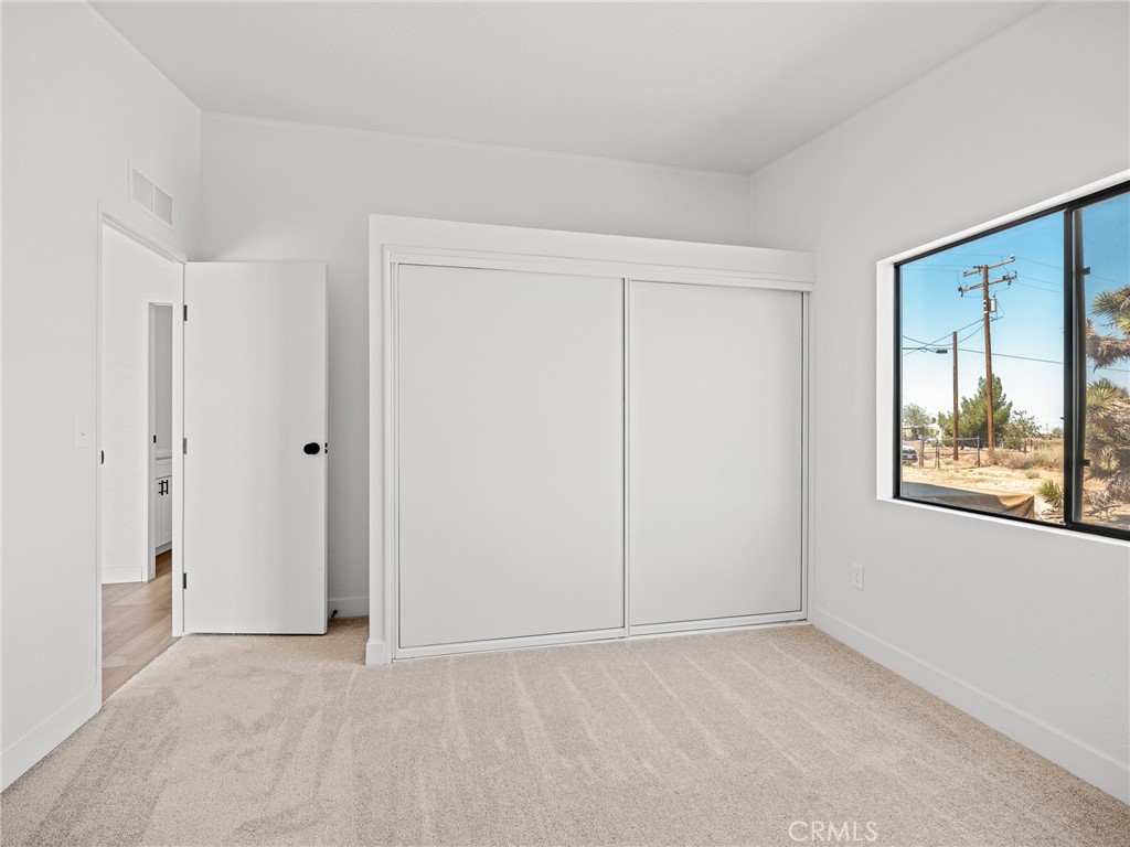 10139 Sonora Road Phelan, CA 92371 - Photo 15 of 37 a view of an empty room with a window