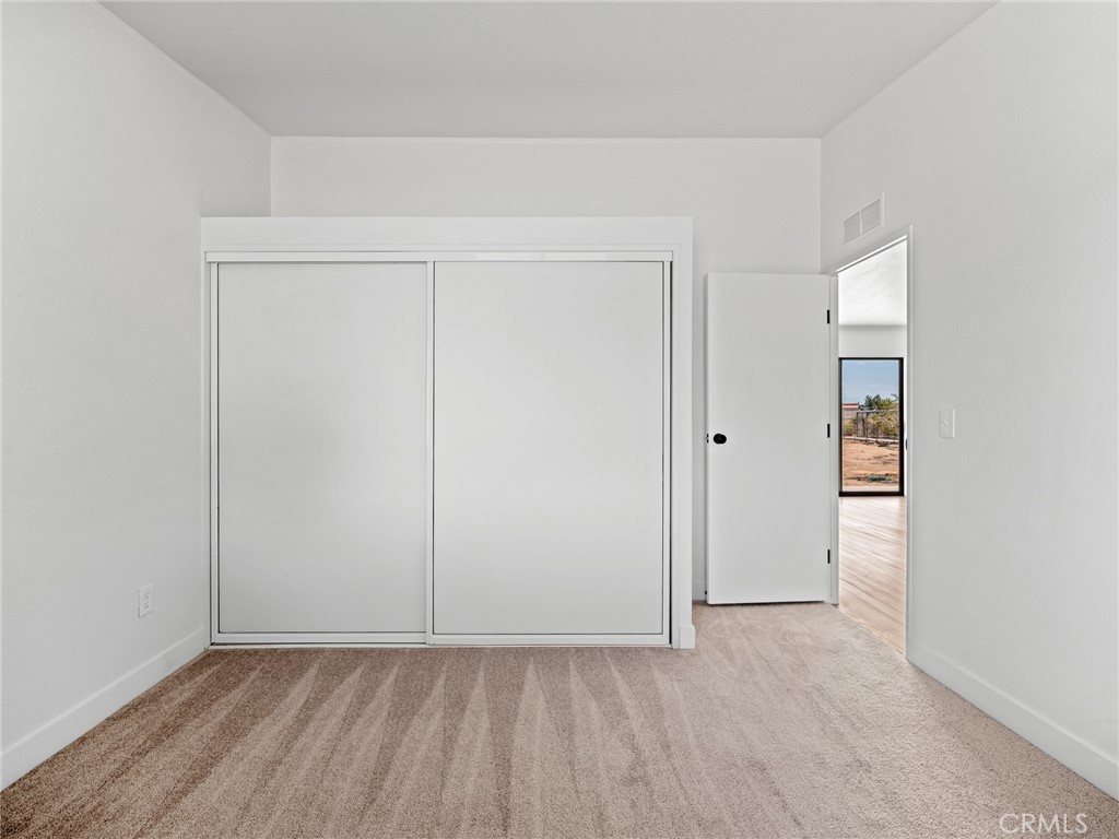 10139 Sonora Road Phelan, CA 92371 - Photo 17 of 37 an empty room with closet
