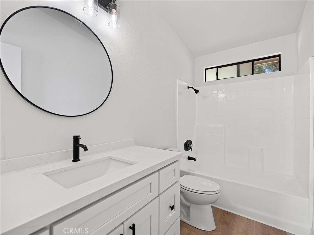 10139 Sonora Road Phelan, CA 92371 - Photo 18 of 37 a bathroom with a sink a toilet and a mirror
