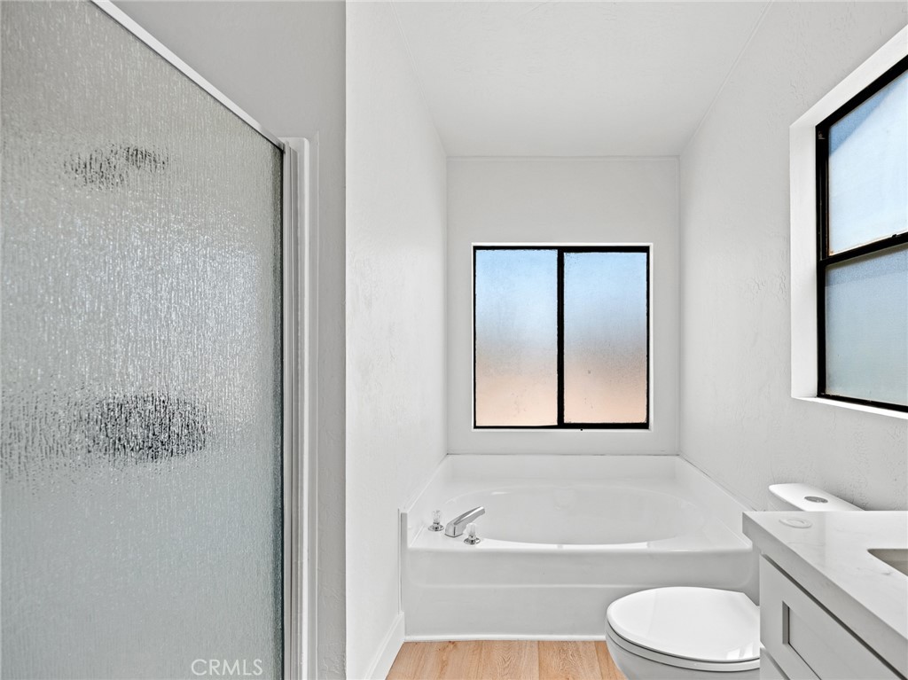 10139 Sonora Road Phelan, CA 92371 - Photo 25 of 37 a bathroom with a toilet bathtub and shower