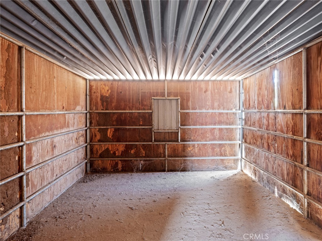 10139 Sonora Road Phelan, CA 92371 - Photo 30 of 37 a view of an empty room with empty shelves