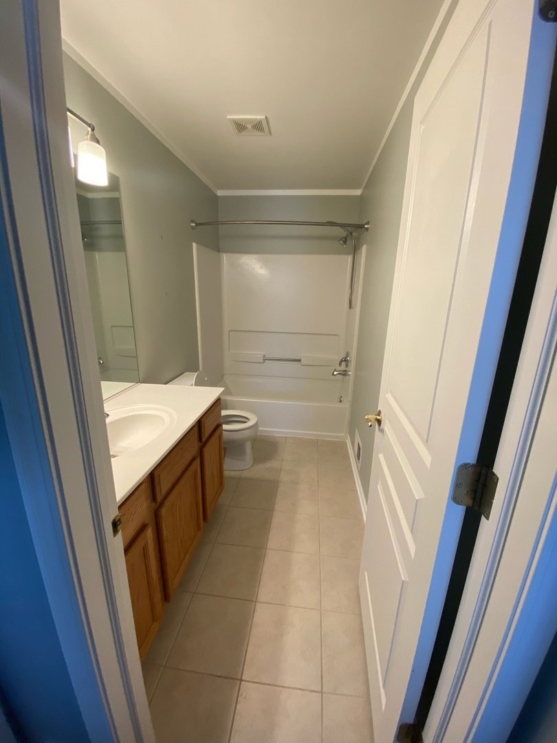 11860 Presley Circle Plainfield, IL 60585 - Photo 13 of 18 a bathroom with a sink and a mirror