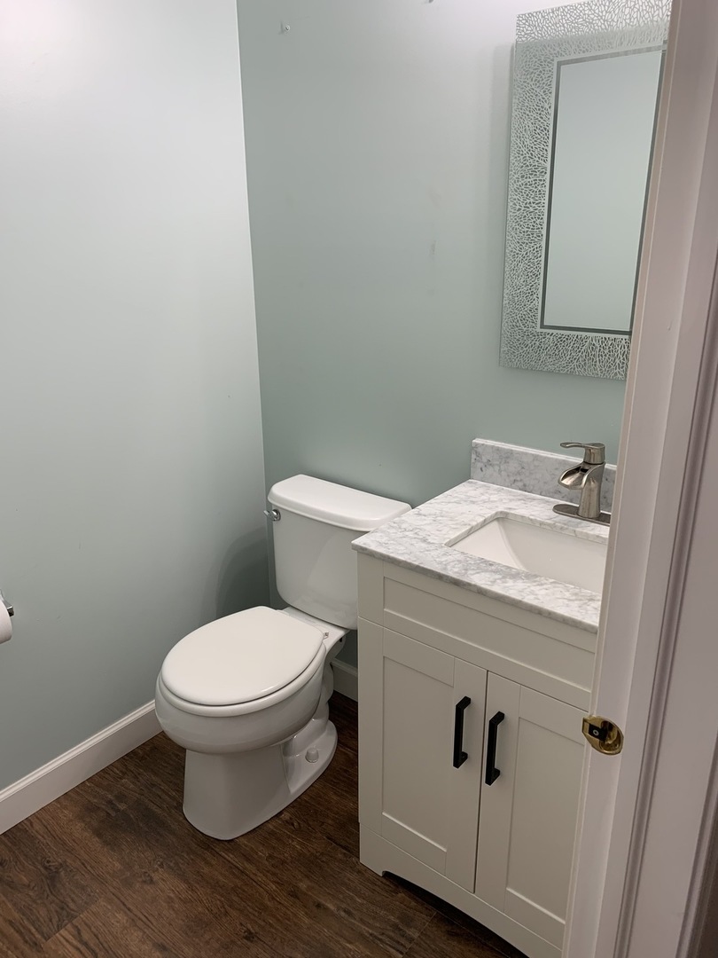 11860 Presley Circle Plainfield, IL 60585 - Photo 8 of 18 a bathroom with a toilet and a sink