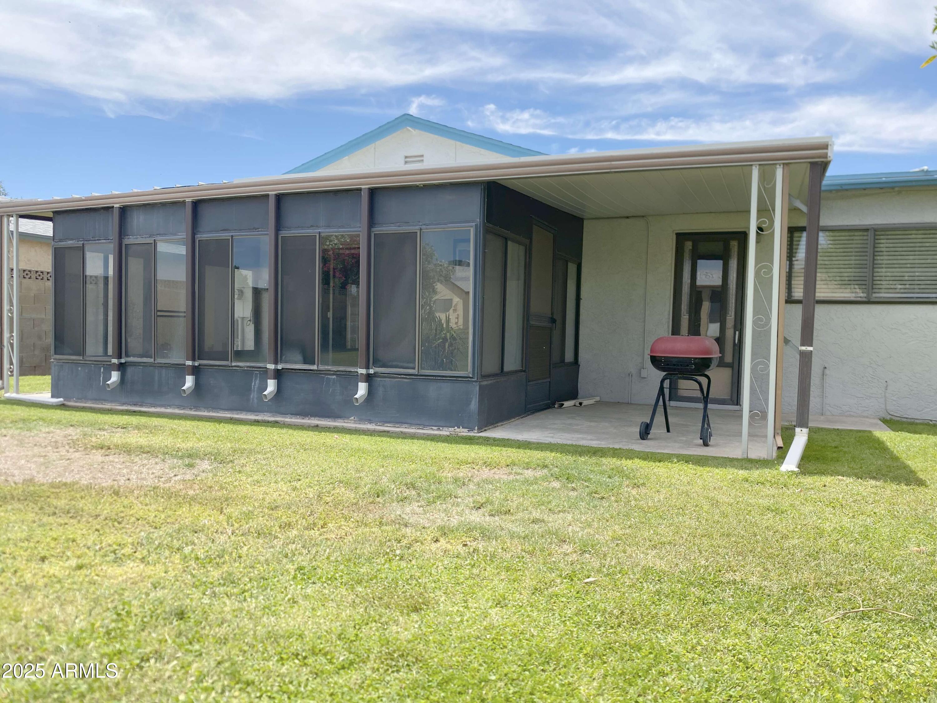 10417 North 95th Drive, Unit B Peoria, AZ 85345 - Photo 14 of 18 a view of swimming pool with an outdoor seating