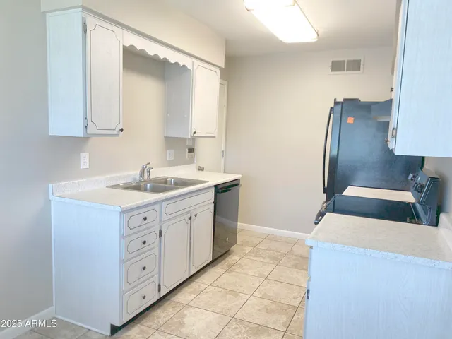 a bathroom with a double vanity sink mirror and