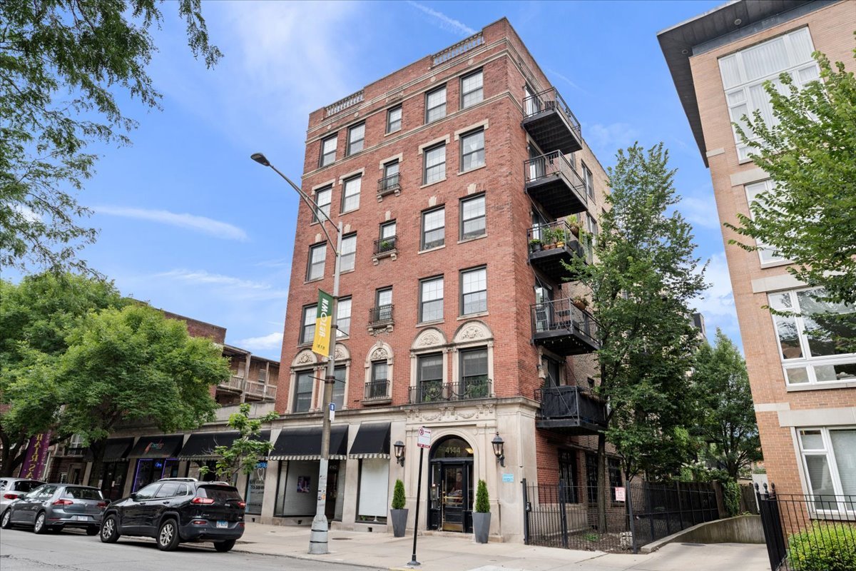a view of a building and a street