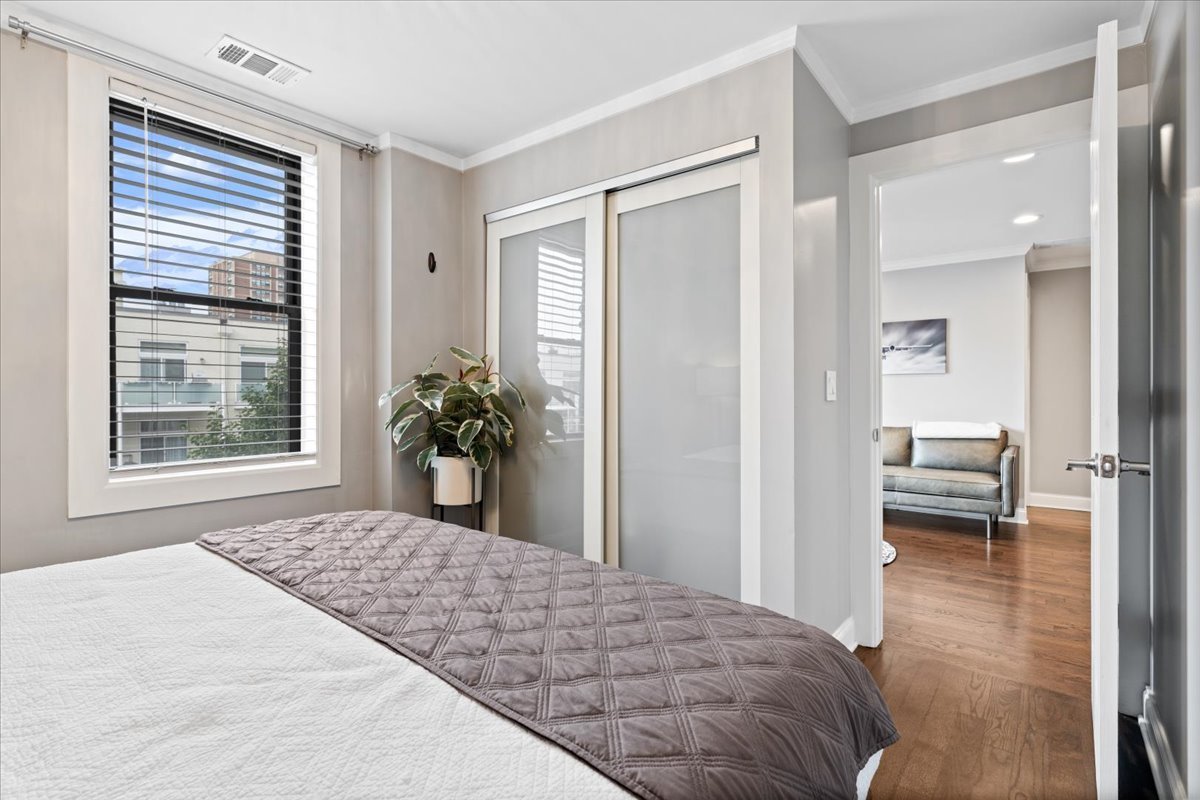 4144 North Sheridan Road, Unit 407 Chicago, IL 60613 - Photo 11 of 19 a bedroom with a bed and a window