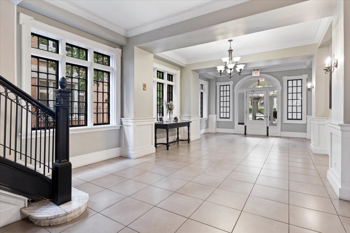 4144 North Sheridan Road, Unit 407 Chicago, IL 60613 - Photo 19 of 19 a view of a livingroom with a furniture wooden floor and a chandelier