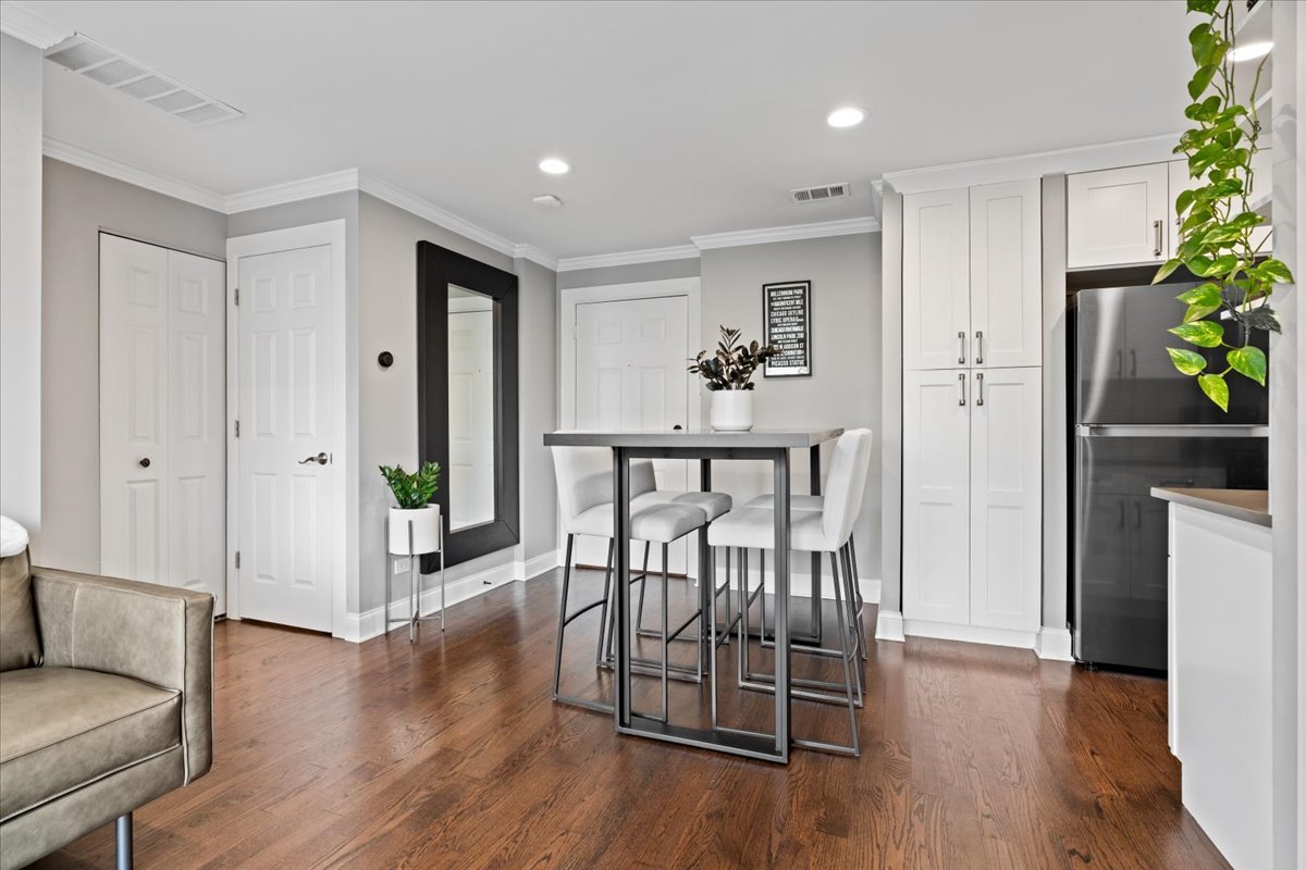 4144 North Sheridan Road, Unit 407 Chicago, IL 60613 - Photo 7 of 19 a view of a livingroom with furniture and hardwood floor