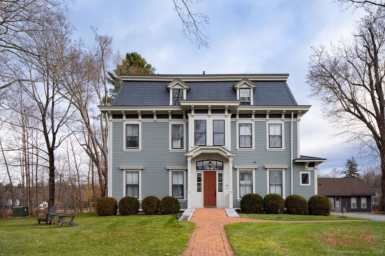 front view of a house with a yard