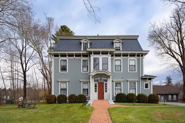 front view of a house with a yard