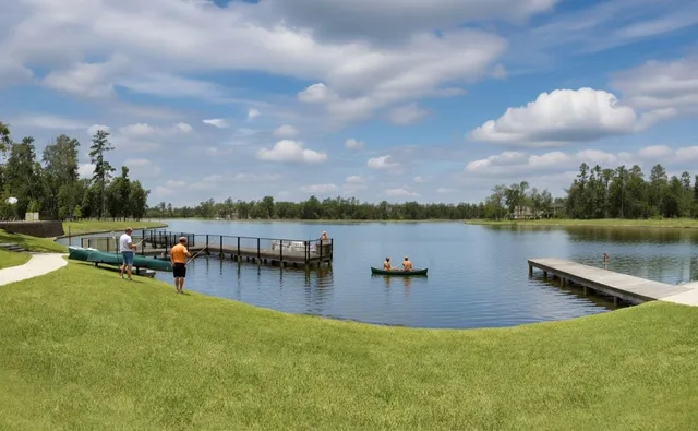 a view of a lake with houses in the back