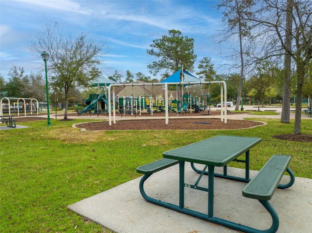 4227 Maple Rapids Lane Spring, TX 77386 - Photo 14 of 16 a swimming pool with outdoor seating and yard