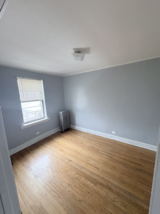 6140 West 19th Street, Unit C2 Cicero, IL 60804 - Photo 6 of 12 an empty room with wooden floor and windows