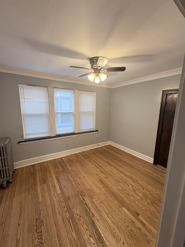 6140 West 19th Street, Unit C2 Cicero, IL 60804 - Photo 7 of 12 a view of an empty room with wooden floor and a window
