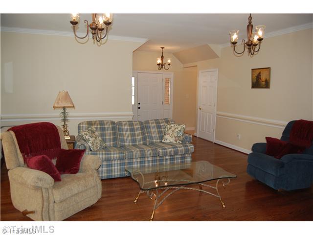 2725 Rowe Road Lexington, NC 27295 - Photo 3 of 16 Living Room. Foyer opens in to the LR which features brand new gas log FP, never used and 9 foot ceilings.