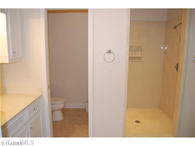 2725 Rowe Road Lexington, NC 27295 - Photo 7 of 16 Master Bath/Spa. Beautiful marble shower with dual shower heads, tile flooring and built in linen cabinets.