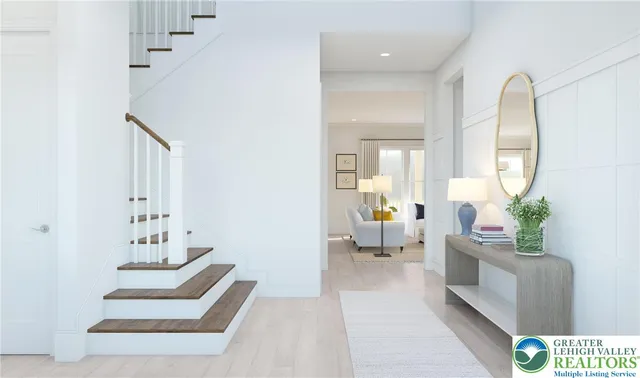 a living room with furniture and a mirror