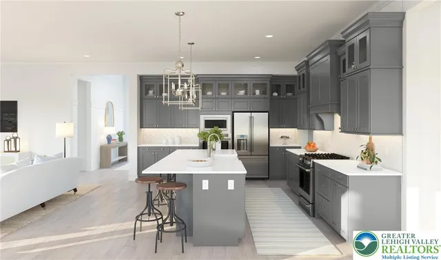 a kitchen with stainless steel appliances kitchen island granite countertop a sink and cabinets