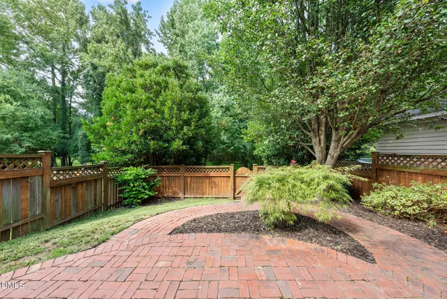 a backyard of a house with lots of green space
