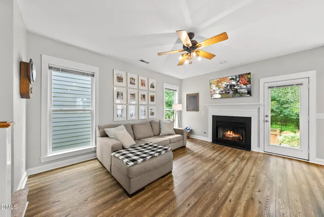 a living room with furniture and a fireplace