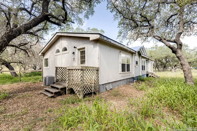 a view of a field with an trees