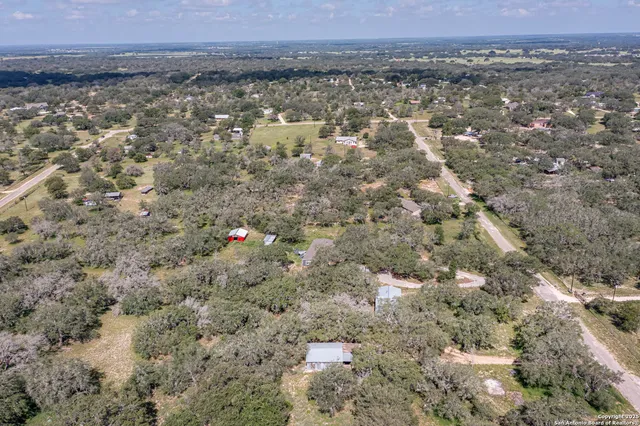 an aerial view of a houses with a outdoor space