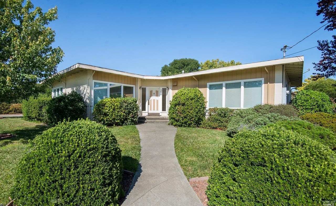front view of a house with a yard