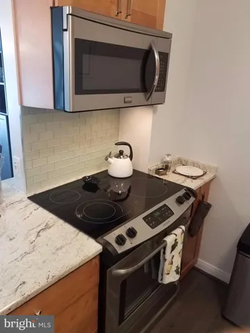 a view of kitchen with furniture and wooden floor