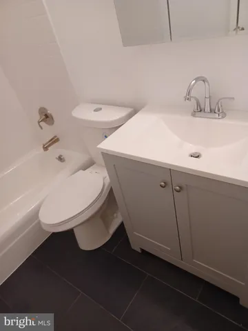 a bathroom with a toilet and a sink