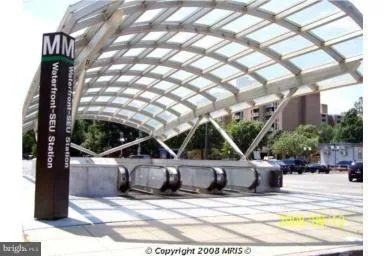 a front view of a building with outdoor seating