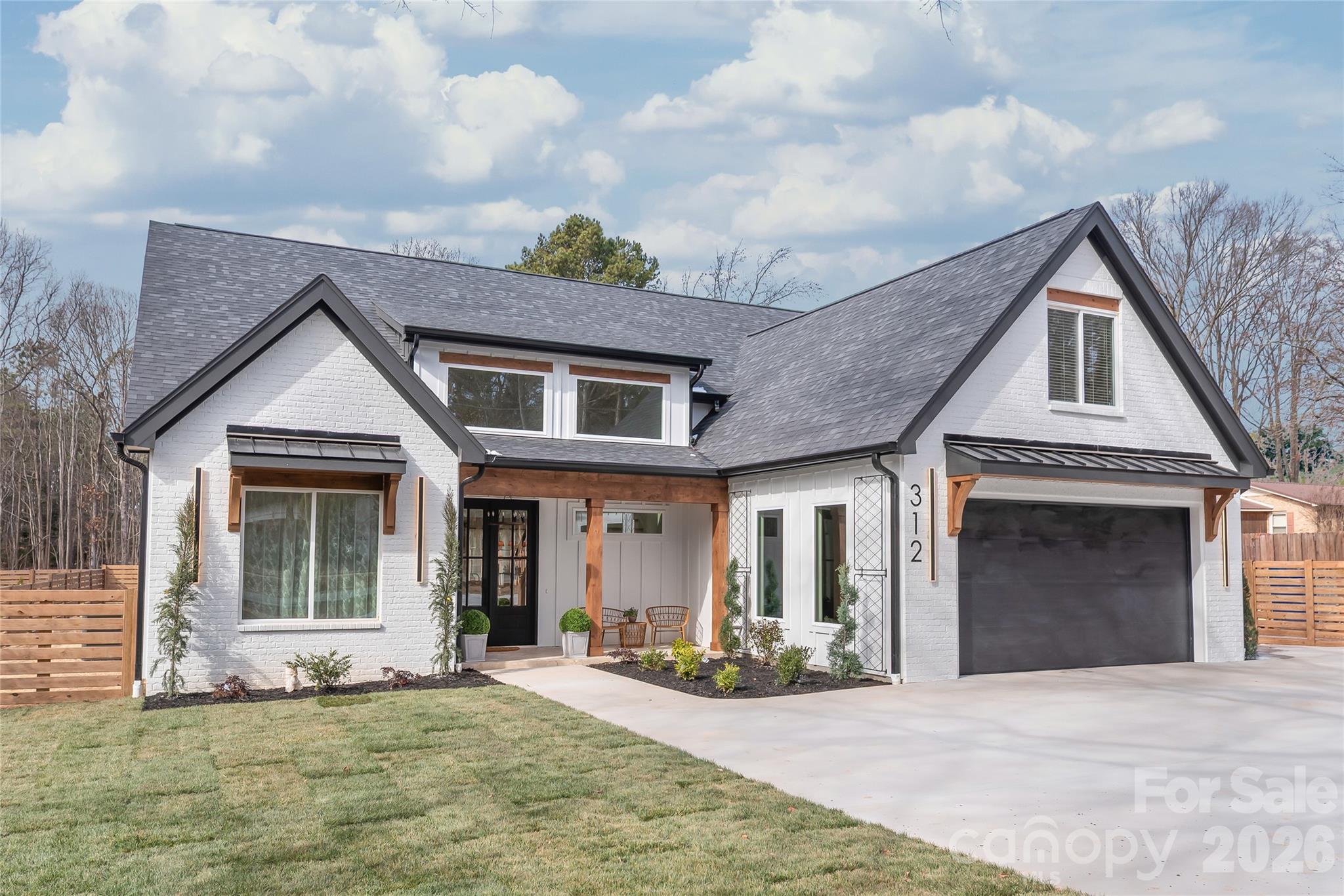 312 Rehobeth Road Waxhaw, NC 28173 - Photo 2 of 40 a front view of a house with yard and green space