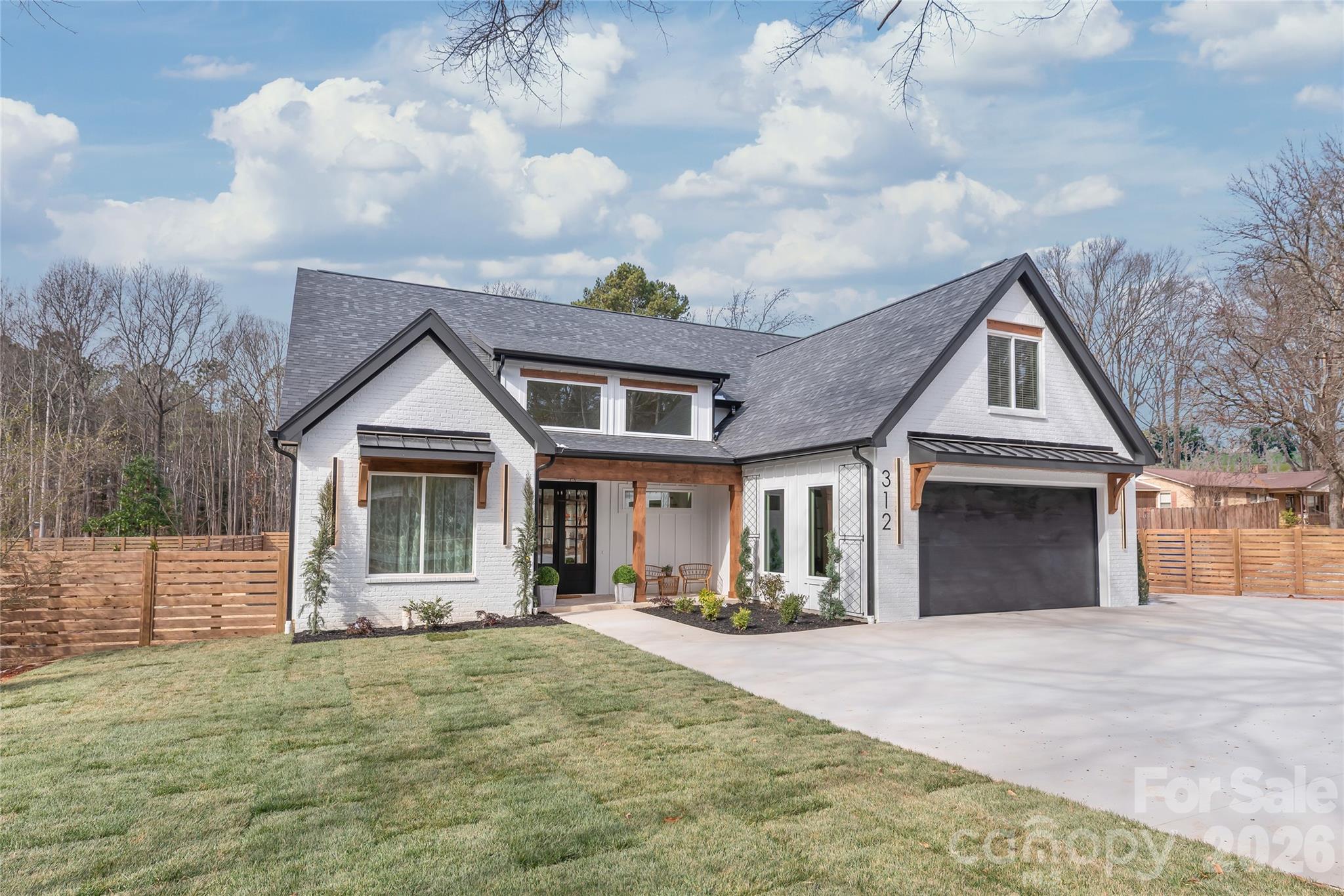 312 Rehobeth Road Waxhaw, NC 28173 - Photo 4 of 41 a front view of a house with a yard and garage