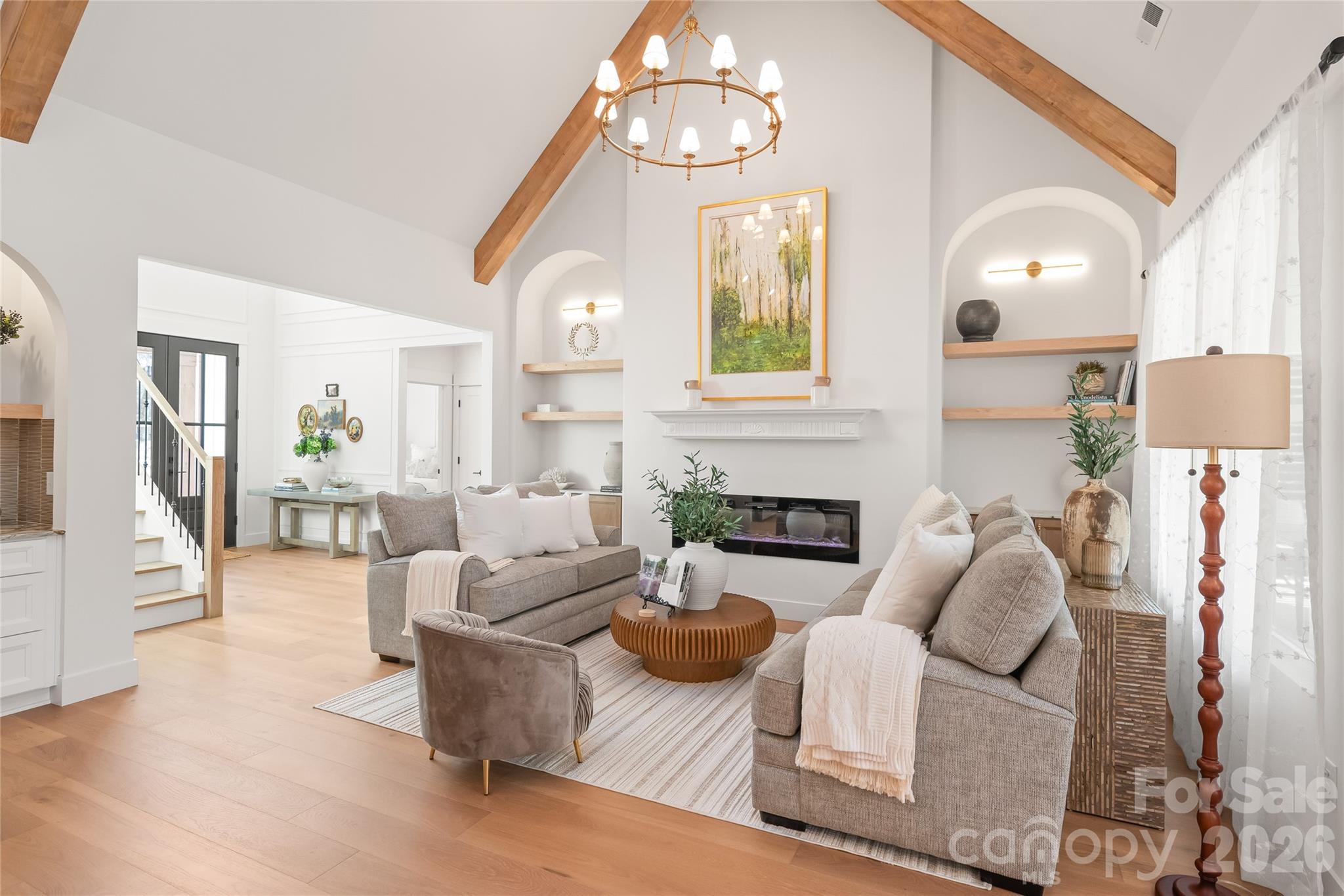 312 Rehobeth Road Waxhaw, NC 28173 - Photo 8 of 41 a living room with furniture chandelier and a fireplace