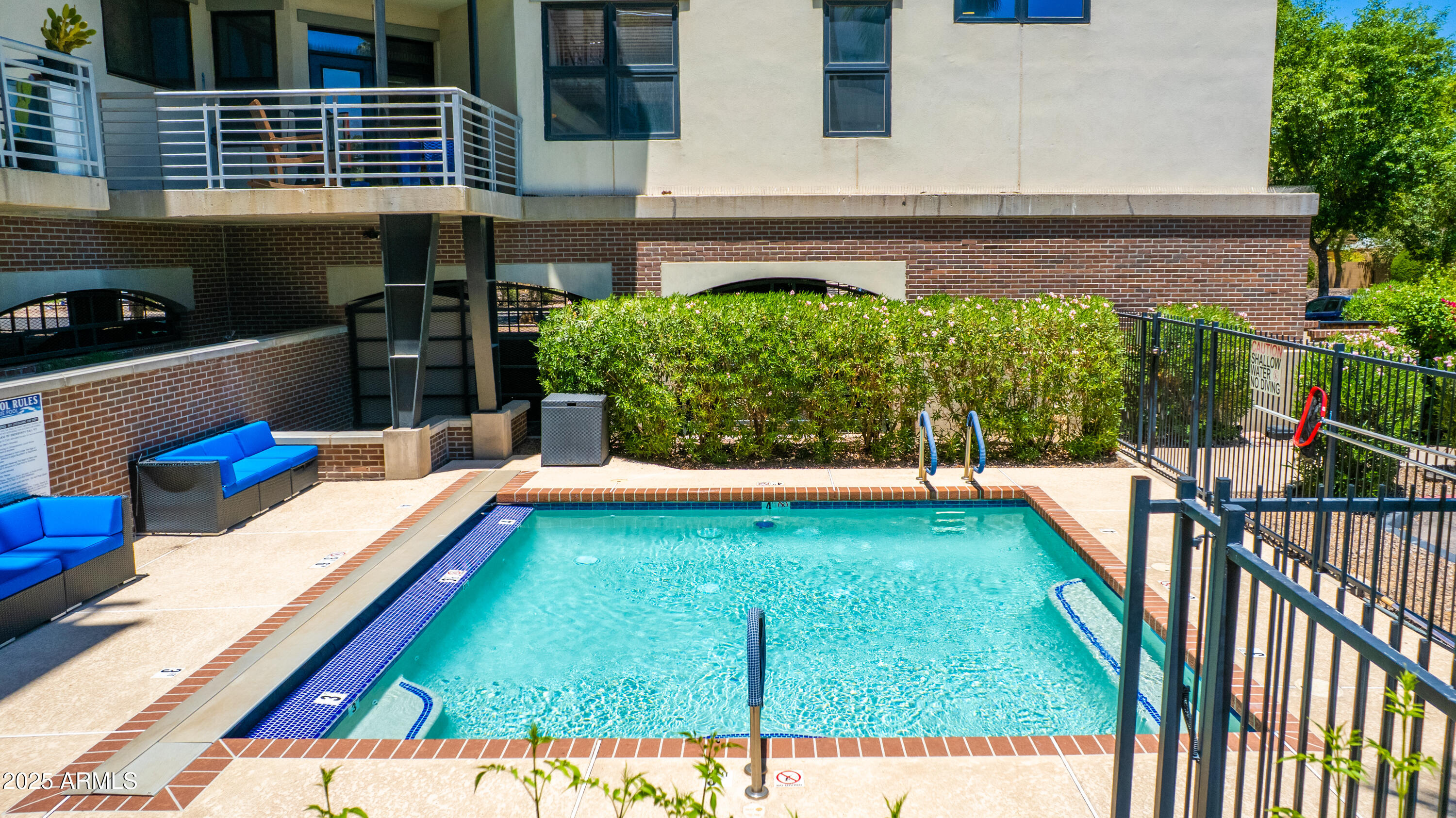 914 East Osborn Road, Unit 208 Phoenix, AZ 85014 - Photo 44 of 53 a view of swimming pool with a lounge chairs