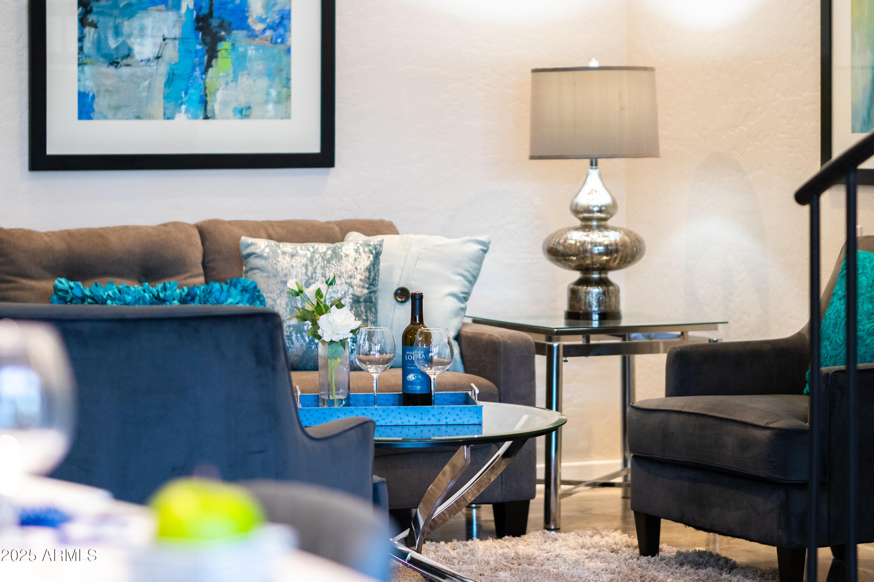 914 East Osborn Road, Unit 208 Phoenix, AZ 85014 - Photo 9 of 53 a table with chairs and a lamp on table