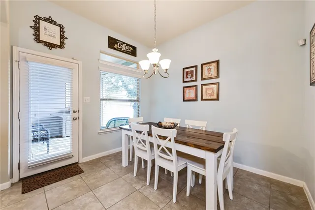 a view of a dining room with furniture and window