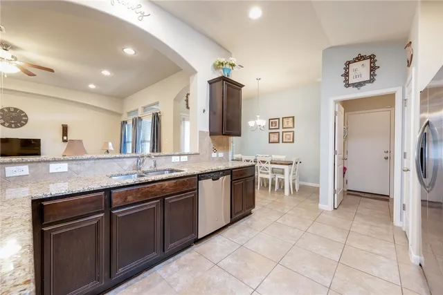 a large bathroom with a granite countertop sink and a mirror