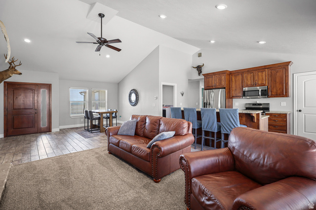 1588 West Rim Rock Drive Stockton, UT 84071 - Photo 3 of 61 Vaulted ceiling with recessed lighting and a ceiling fan