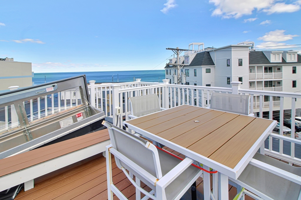 10 Berkley Road, Unit A Hull, MA 02045 - Photo 21 of 25 a view of a patio with a table and chairs