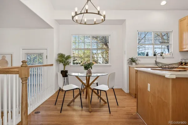 a view of a dining room with furniture window and wooden floor