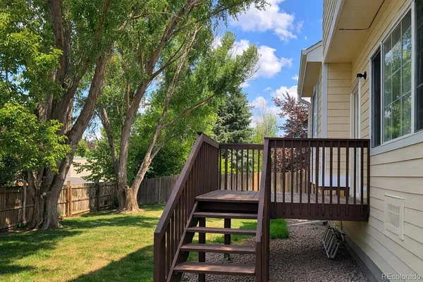a view of a deck with a backyard